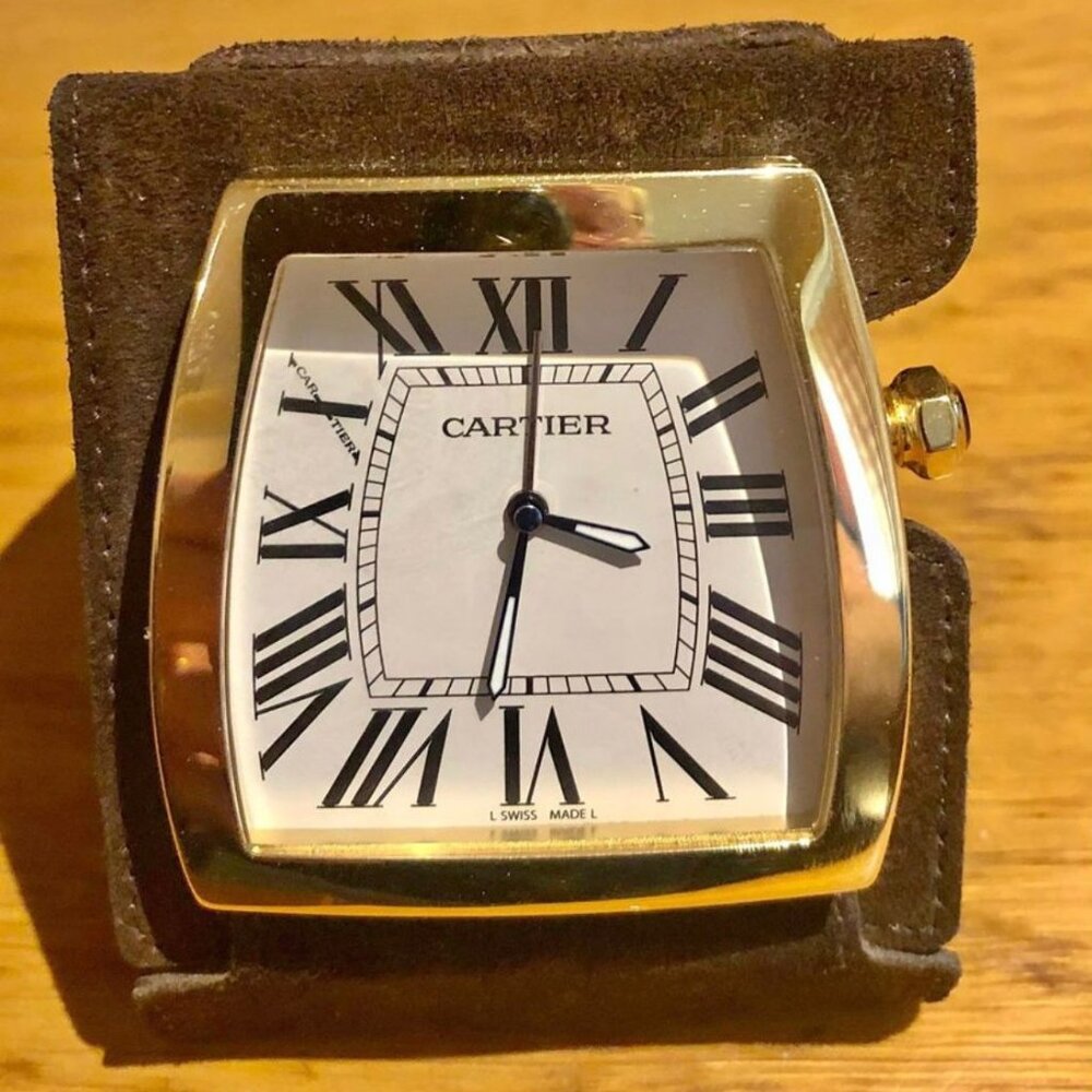 Cartier gilt brass quartz folding travel alarm clock with brown suede case